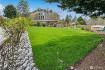 The stone patio gives way to this level lawn, perfect for croquet or badminton!