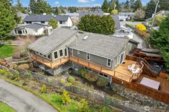 Tucked away from the street, the home faces a green belt, literally turning its back on the world outside. Roof material is concrete tile.
