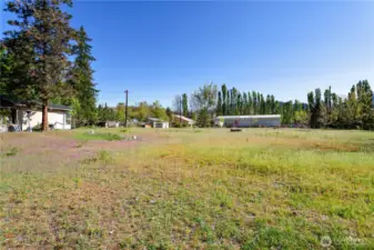 Level, cleared building site. Bldg. permit was approved, has expired.