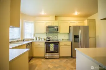 Kitchen provides plenty of practical space and storage for cooking your favorite meal.