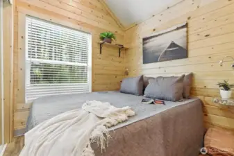 primary has built in endtables, vaulted ceiling and mirrored door closet