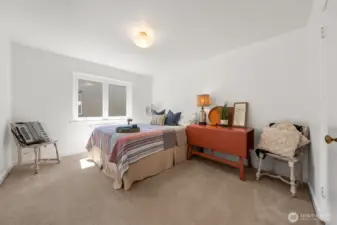 The larger bedroom also has been staged with a queen bed. Large closets thoughout, with separate locked storage on the first floor.