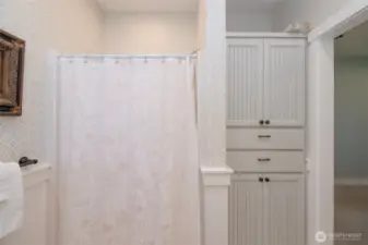 ADU primary bathroom with shower and built-in storage