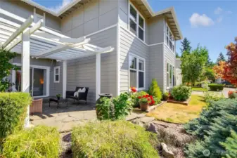 Custom designed patio with lattic cover and surrounding landscaping. One of a kind and beautiful!