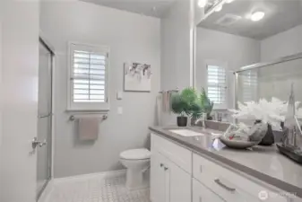 Remodeled 3/4 bathroom with shutter. Tile flooring.
