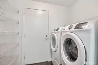 Walk-in laundry/pantry room. Side-by-Side washer/dryer conveys.