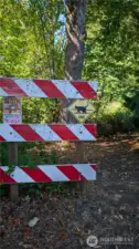 This is the dead end sign at the end of E Maryland. Walk down the path from this point and you will see the property corner marker.