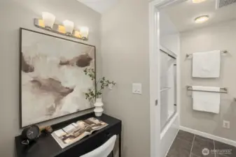 Flexible nook in the primary suite, ideal for vanity or desk use, with direct access to the dual-entry bath.