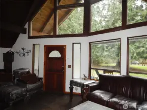 Three story windows on the front of the home