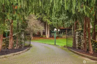 Mature landscape at gated entrance.