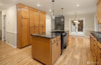 Updated kitchen with granite countertops, pendant lighting.