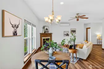 Dining space situated between the kitchen and dining has plenty of space for any size table.