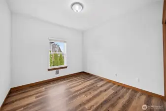Second bedroom with new flooring.