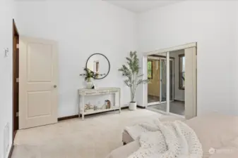 Primary Bedroom with a View to the Sunroom