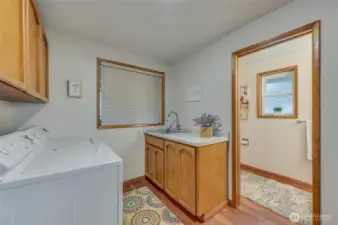 WOW that's a big laundry room, adjacent bath