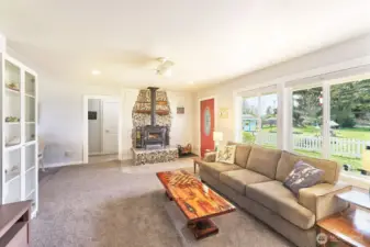 Living room has a woodstove to keep the house warm and dry in the winter months