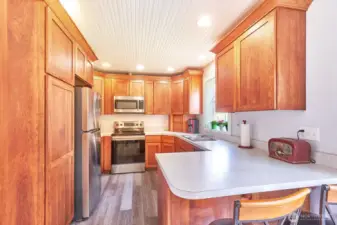 Beautiful cabinets and almost new appliances in this well-planned kitchen