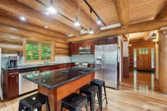 Beautiful ceiling beams throughout including the open concept kitchen.