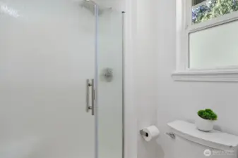 The primary bathroom has a closed off area with the toilet and shower stall.