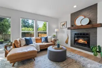 The family room has large windows looking out over the stamped concrete patio.
