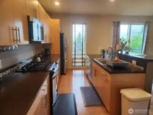 The kitchen boasts extensive and functional cabinetry.