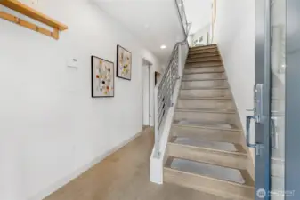 The entry level with the 2 bedrooms, full bath, Laundry Closet with full size W&D, ascend the designer floating stairway to the main living area.