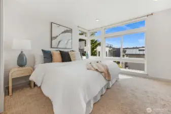 Upstairs primary suite has this level all to itself.  A wall of windows with nice views to the east and southeast.