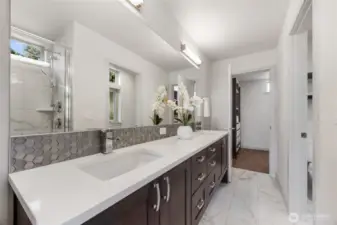 View to the back walk-in closet and the private commode to the right.
