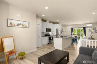 The main-level living room sits just beyond the kitchen—ideal for keeping the conversation going while cooking or hosting.