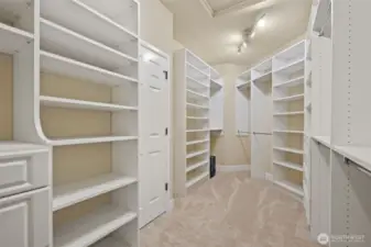 Walk-in closet with two safes attached to the floor.