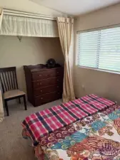 Closet in secondary bedroom