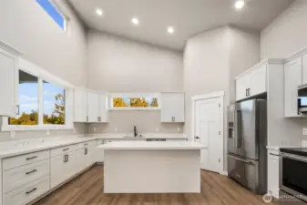 Chefs kitchen showcasing quartz slab counters...
