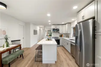 Three eating spaces: bar, nook, dining area.