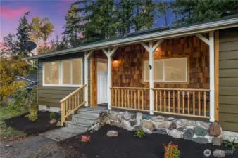 Welcoming large porch to sit and watch the world go by with your favorite beverage.