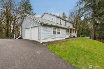 Main floor living is accentuated by a spacious two-car garage. Easy-care vinyl siding saves dollars on exterior paint jobs!