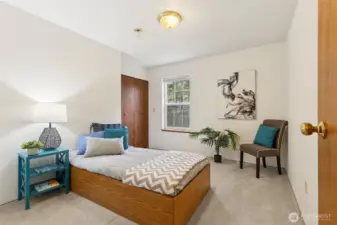 One of three additional bedrooms on the upper level show the ample size of the rooms, all located centrally around the secondary full bath.