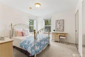 The large corner bedroom is well suited for a queen bed for guests or use for many other options.  Two mirrored closets are included in this the 3rd of the 3 additional bedrooms, making 4 upper bedrooms total with the primary.