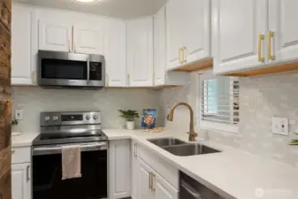 Renovated Kitchen with Quartz Counters and Custom Tile Backspash
