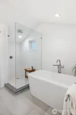 Free-standing bath and large shower provides spa-like luxury