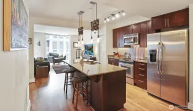 Center island kitchen with pantry and full size stainless steel appliances