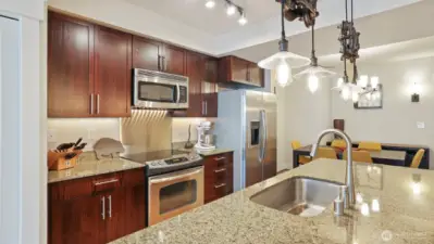 Center island kitchen with pantry and full size stainless steel appliances