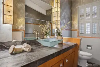 beautifully appointed and artistically designed full bath on the upper level.