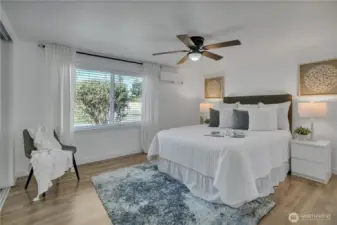 Bedroom 1 with large window and ceiling fan