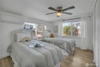 Second spacious bedroom with large bright windows
