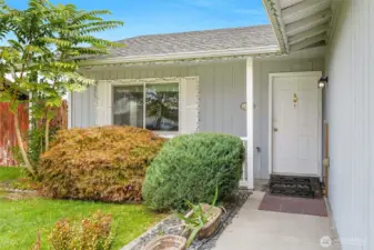The front porch is perfect for hanging out with a cup of coffee and having privacy at the same time.