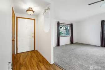 The front doorway has plenty of light, and includes an opening into the living room where you can set your keys so you don't forget them.