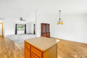 Kitchen, dining room, and living room.  Beautiful light fixture in the dining area.