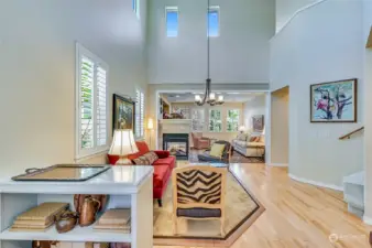The entry has been enhanced with a custom bookcase. As you enter on to pristine hardwood floors you immediately notice the dramatic ceilings and abundance of natural light.