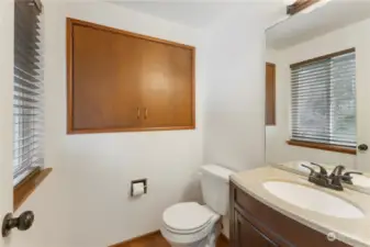 Half bath off primary bedroom. The cabinet can be removed to add a step in shower.