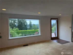 One of two large picture windows looking south to the peek view of Quartermaster Harbor.